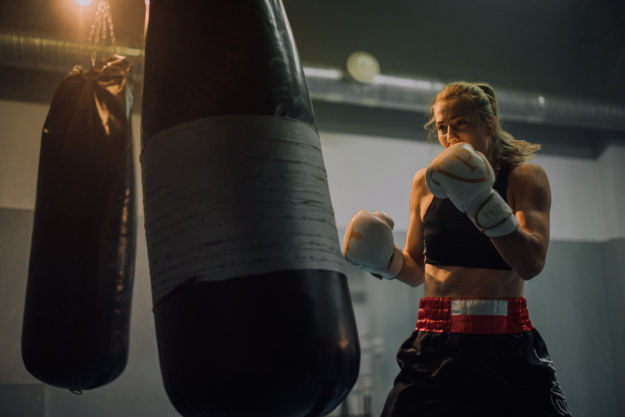 Woman boxing training on a bag